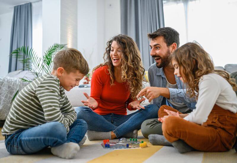 parents playing board games with kids