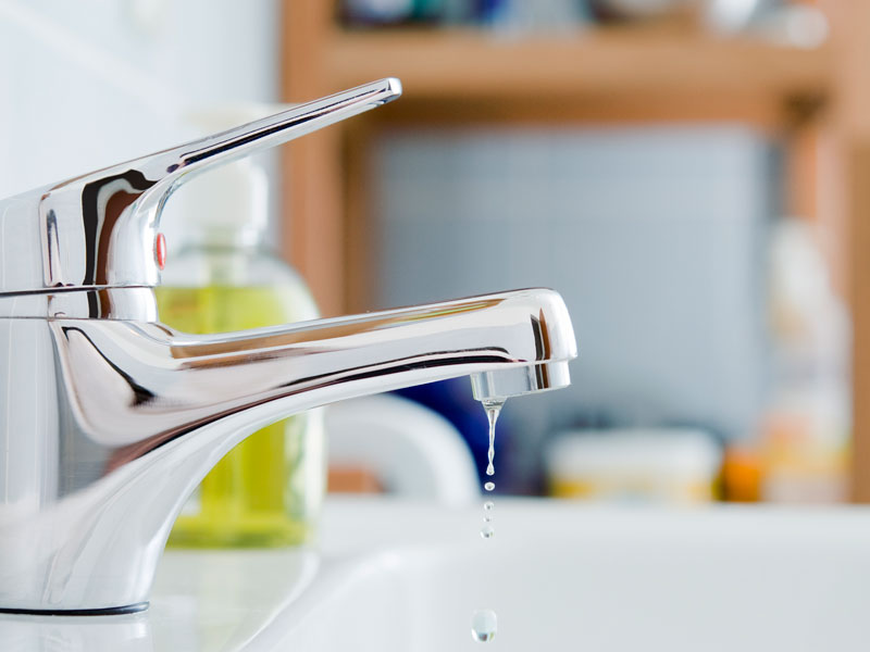 sink faucet dripping water